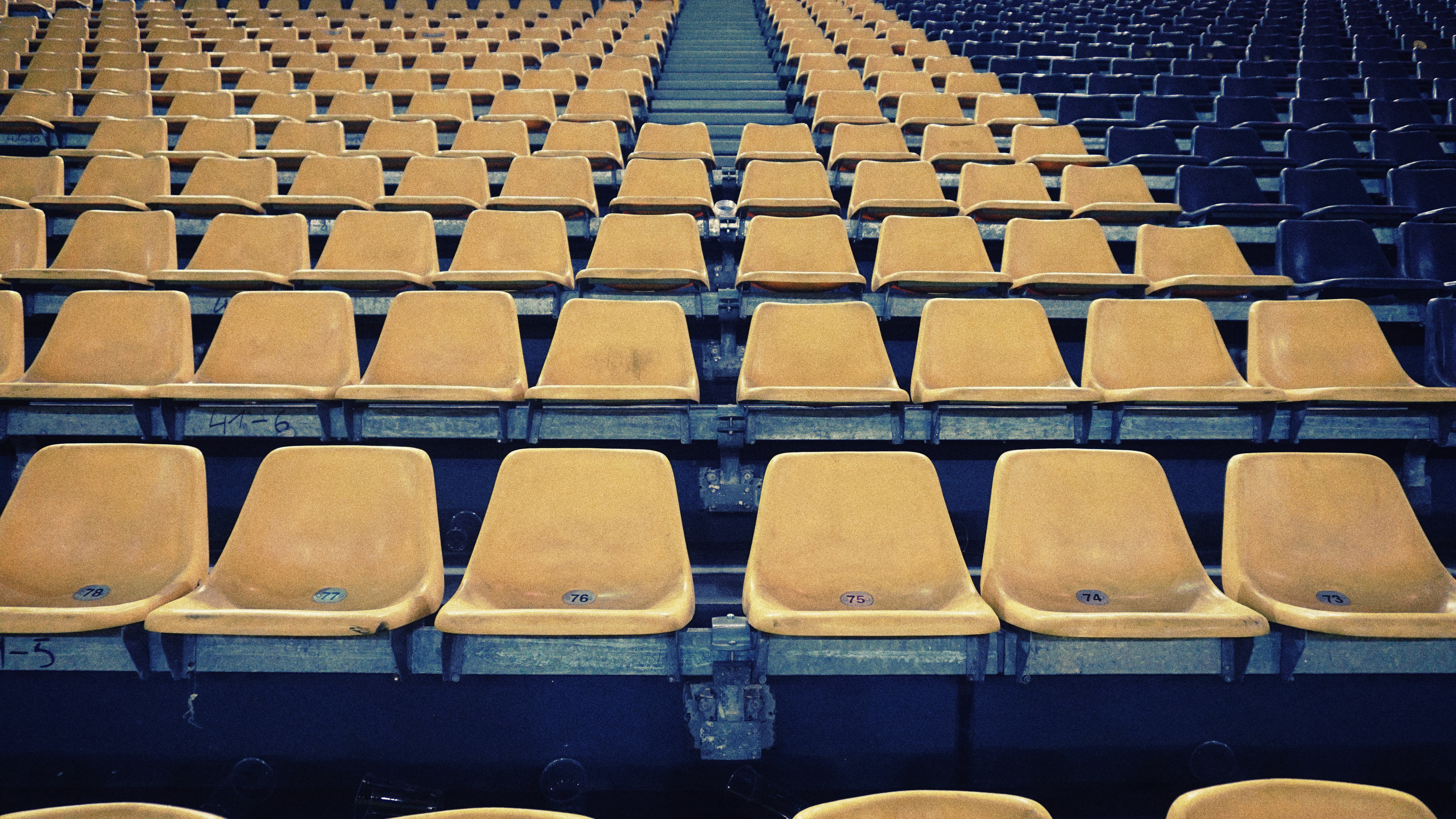 yellow chairs in football stadium